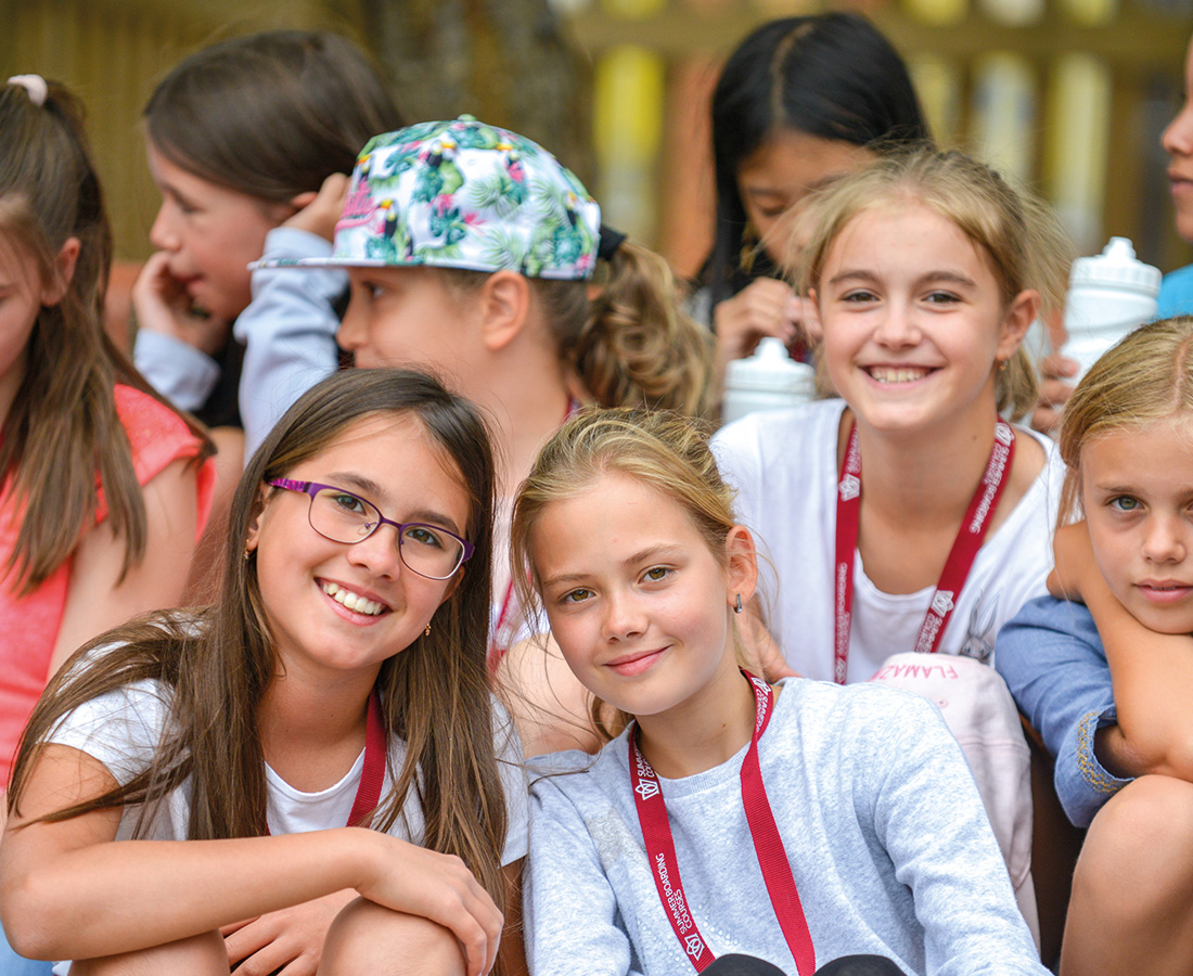 Group of happy smiling students at camp dragon