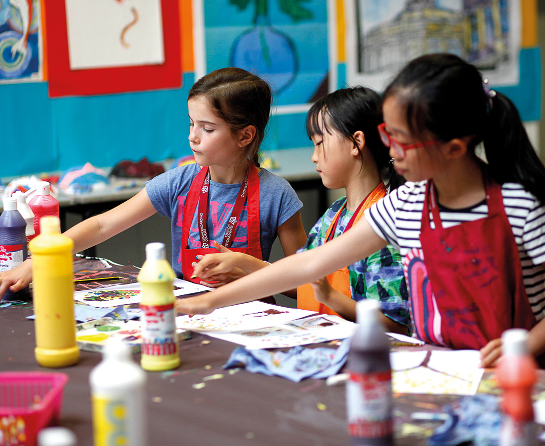 Three Female Student Doing Arts and Crafts at Camp Dragon