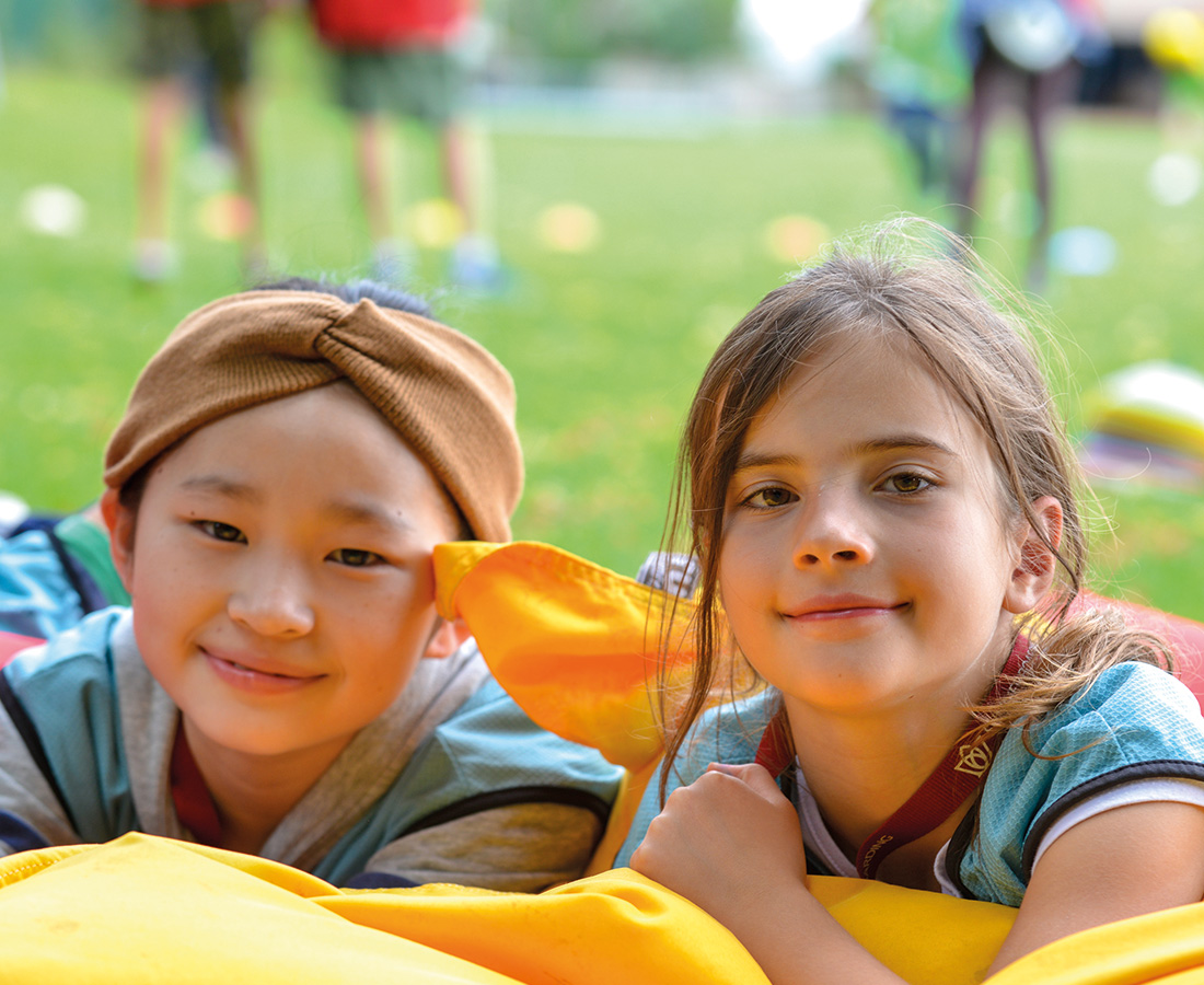 Two students smiling at the camera at camp dragon